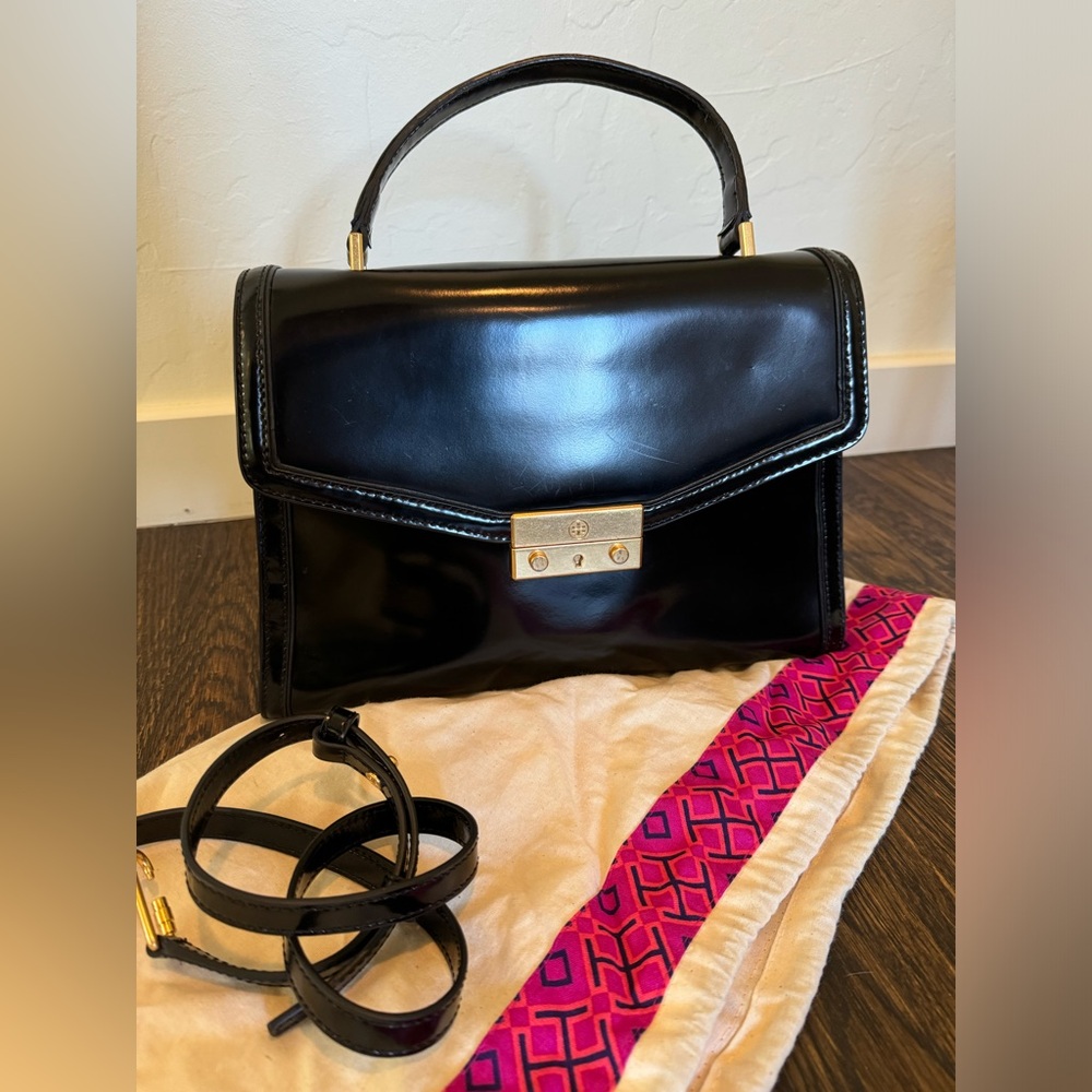 Tory Burch top handle black handbag with removeable crossbody strap, gold latch.